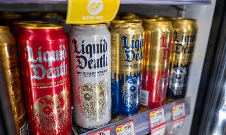 Is liquid death bad for you - Different types of liquid death cans in selling shelf.