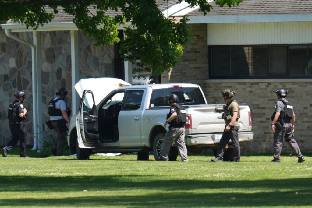 Police: Man opened fire outside a church before staff fatally shot him