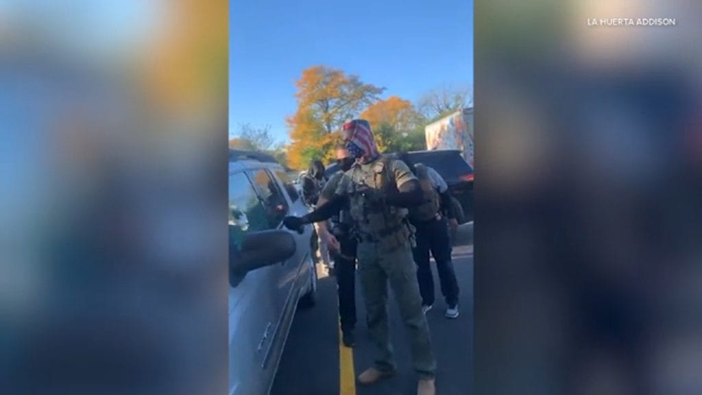 Video shows federal agents break car window, detain driver in Addison; protesters speak out