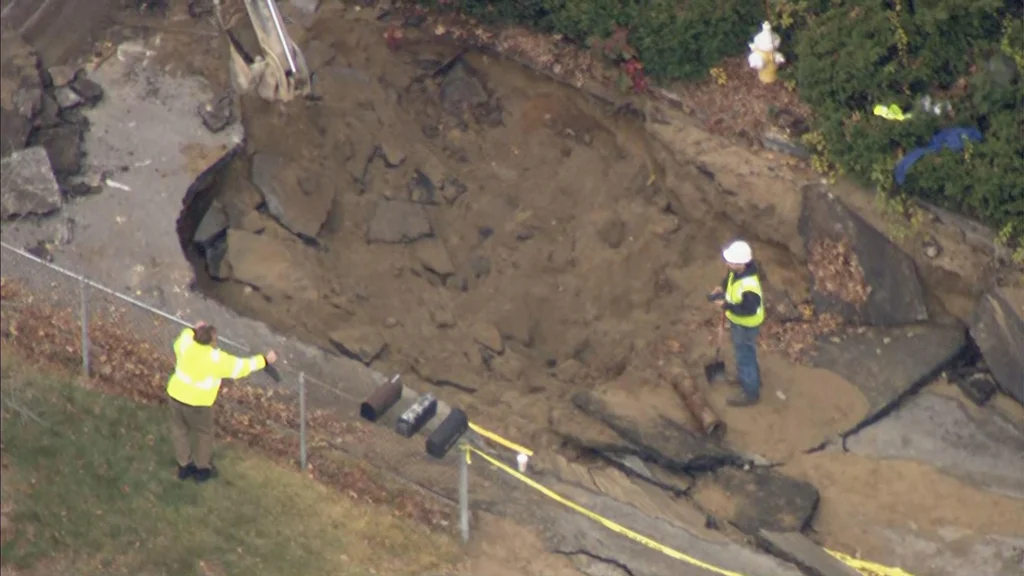 Cleanup underway in Westford after water main break floods homes, collapses road