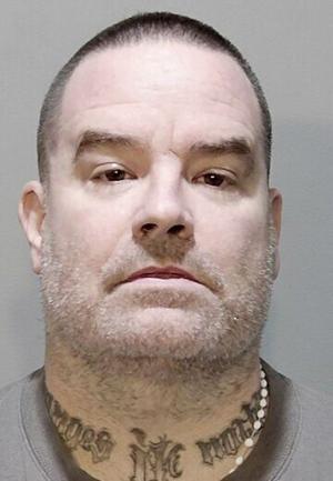 Probation violator accused of spitting on prosecutors