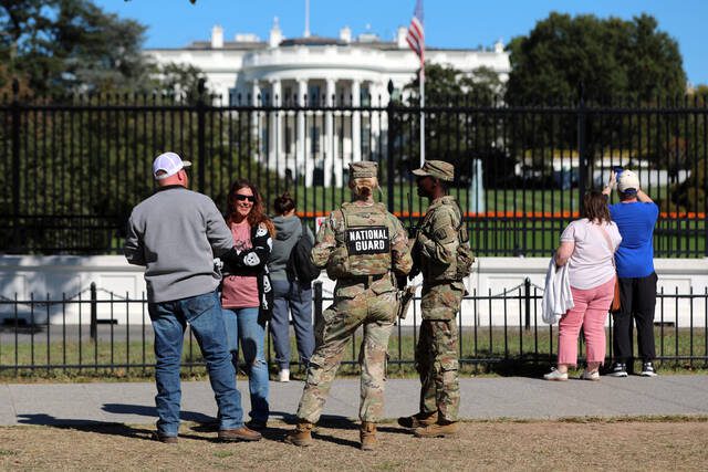 2 National Guard members shot in Washington, D.C., and their condition isn’t known, AP source says