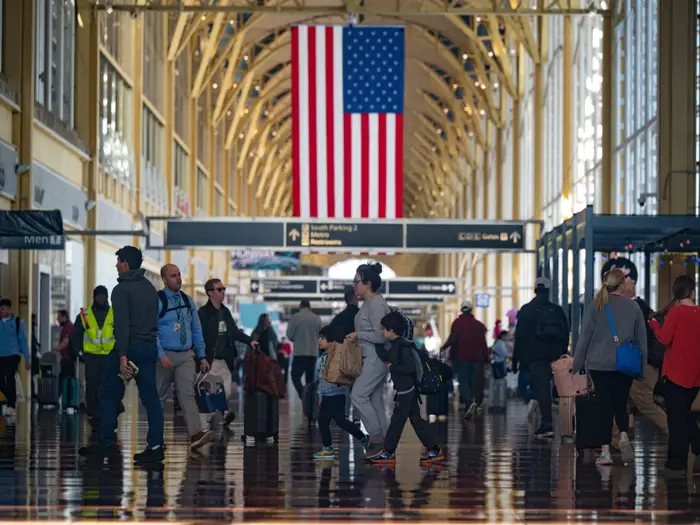 Mass delays and stranded travelers: Photos capture airport chaos amid the longest government shutdown in US history