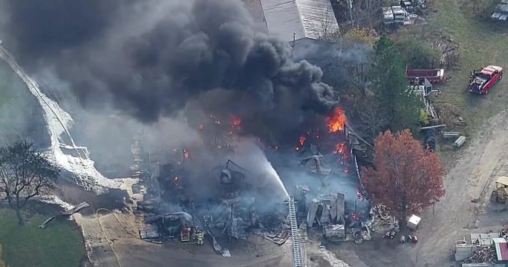 Video: Crews battle massive barn fire in Howell