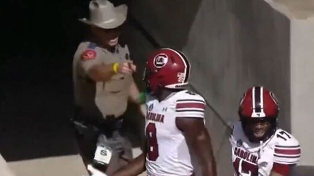 Texas police officer sent home after bumping into college football player and pointing finger in bizarre tunnel incident