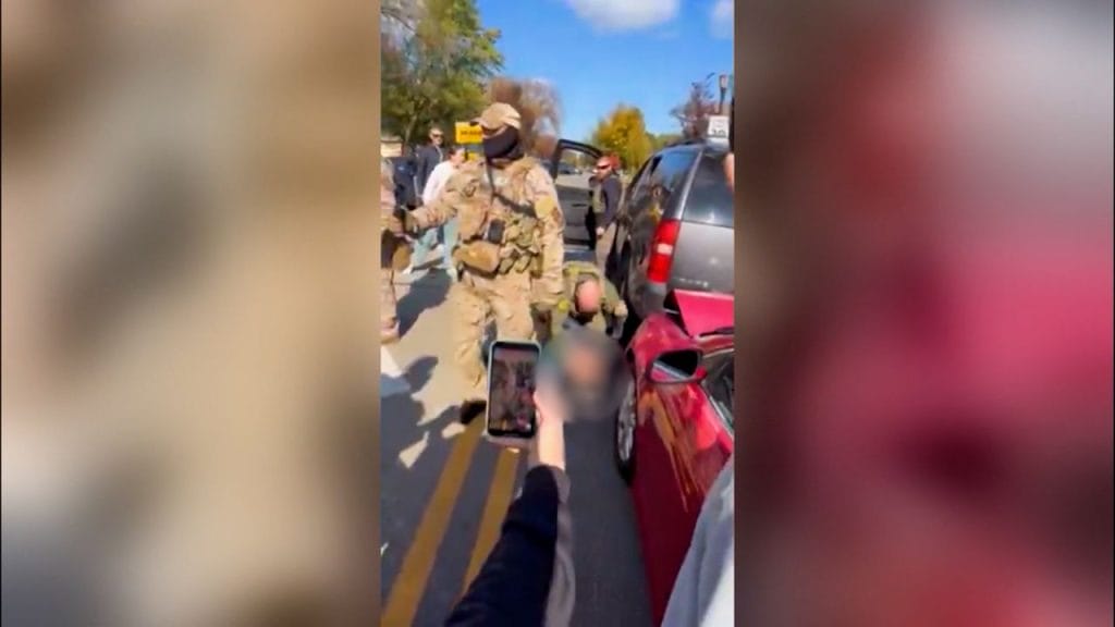 Video shows federal agents strike man pinned to the ground during enforcement act