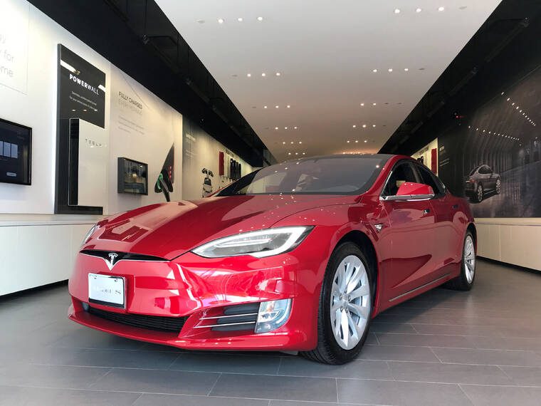 Tesla sued by family who says faulty doors led to wrongful deaths