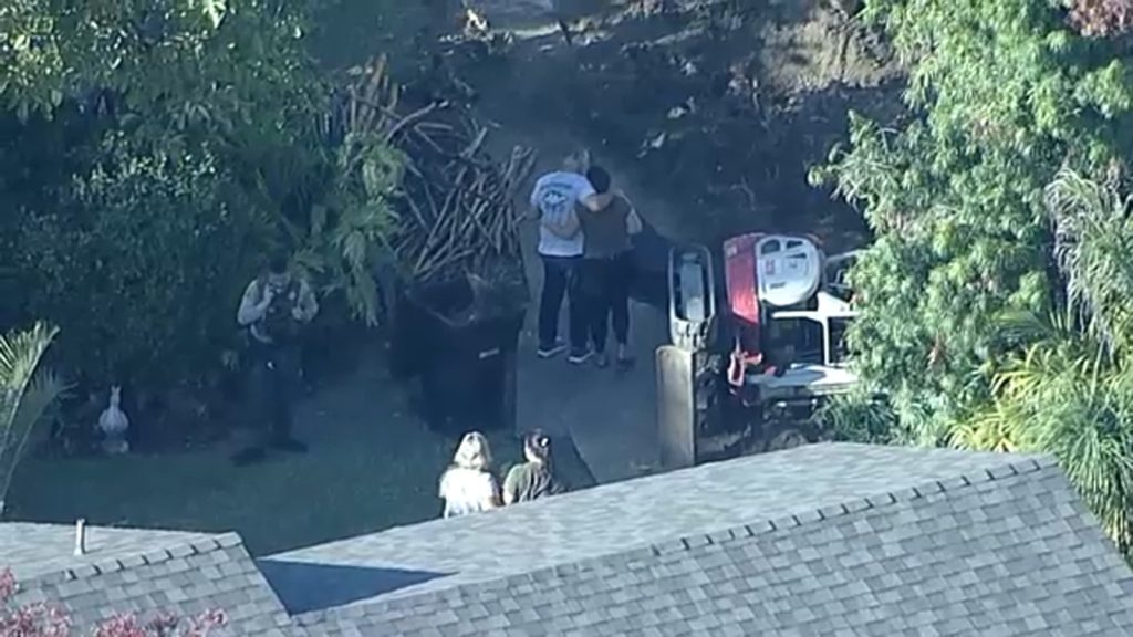 Person dies after being trapped under backhoe in Arcadia