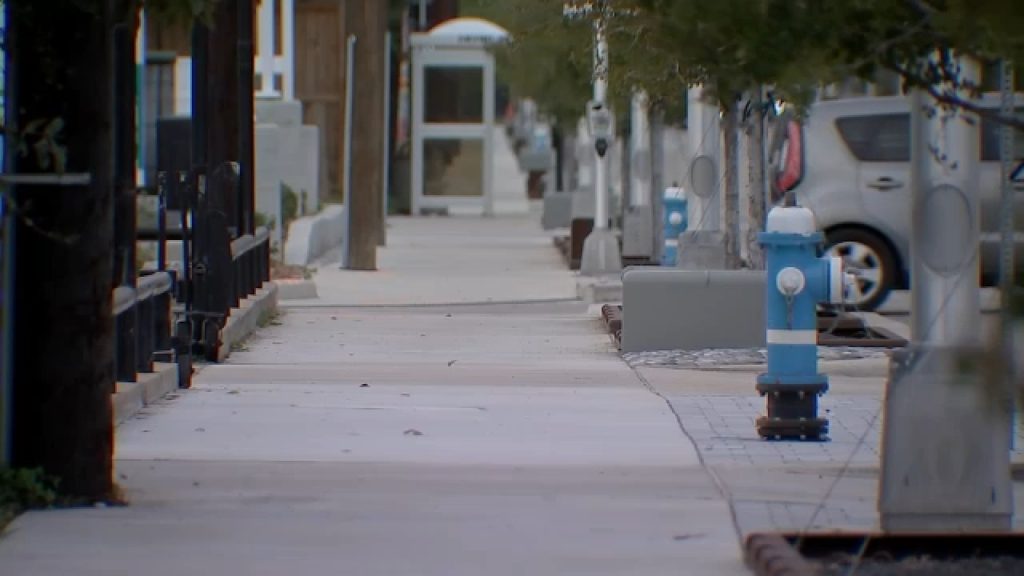 Woman charged after being found intoxicated on sidewalk holding 3-month-old son, records say