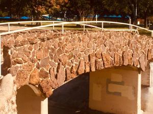 Car hits Quakertown Park’s Depression-era rock bridge; Dallas driver arrested