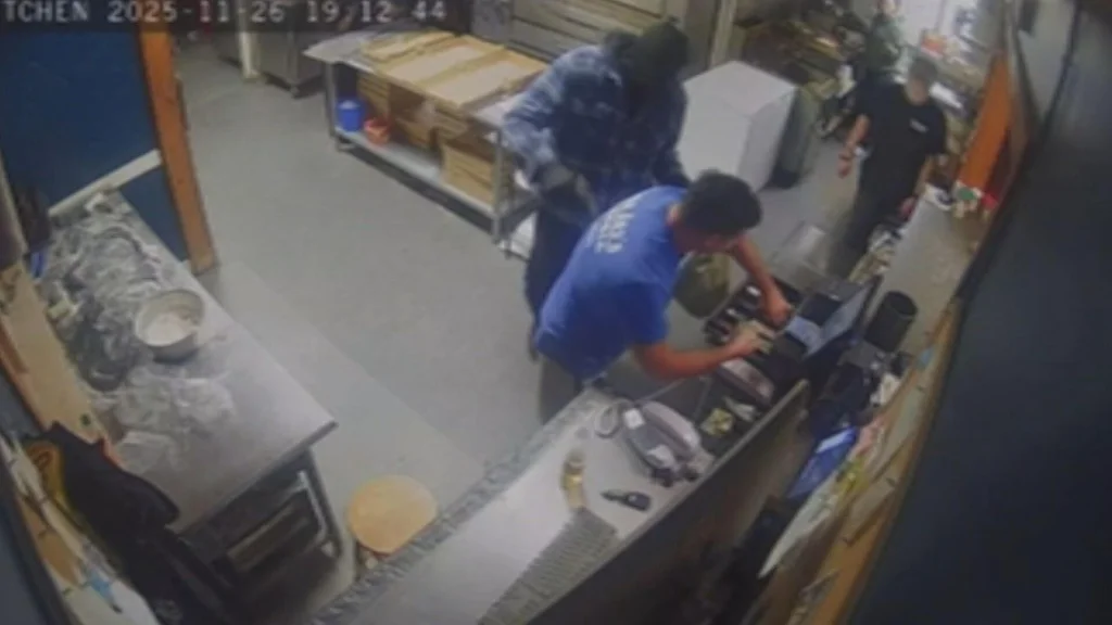 Video shows man robbing pizza restaurant at gunpoint in Dover, New Hampshire