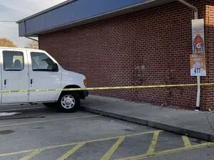 Van jumps curb, crashes into Huber Heights gas station