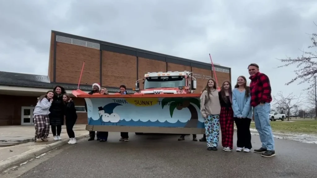 Students paint snowplow ‘think sunny thoughts’ in Macomb County