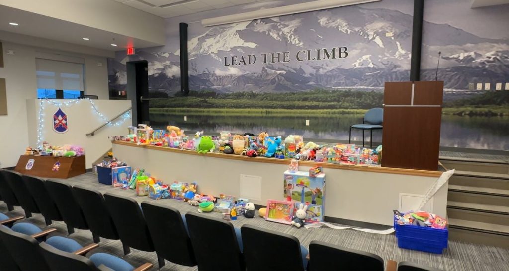 Fort Drum soldiers march through snow to deliver Mountain of Toys