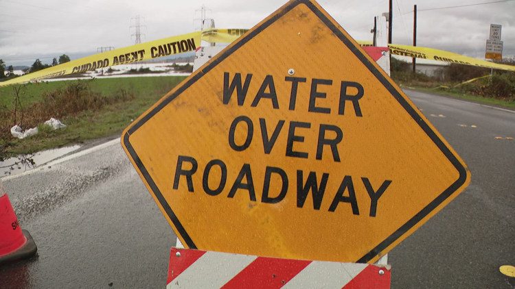 Man drowns after driving car onto flooded road in western Washington