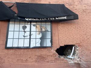 Out-of-control car crashes into St. Louis pet clinic, puts hole in building