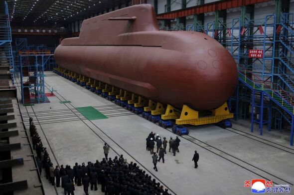 Kim Jong Un unveils ‘nuclear-powered’ submarine as he threatens retaliatory strikes