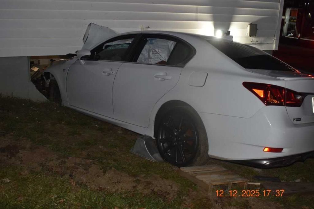 Driver hospitalized after car crashes into Mass. home