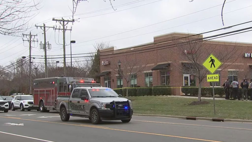 Two cops shot and suspect dead after gunfire erupted in busy shopping center the day after Christmas