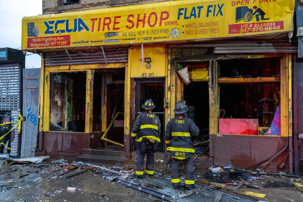 Ten injured, including firefighters, in Queens tire shop and apartment building fire