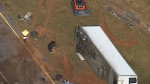 Driver killed after tractor-trailer hits guardrail, overturns along I-75 in Cobb County