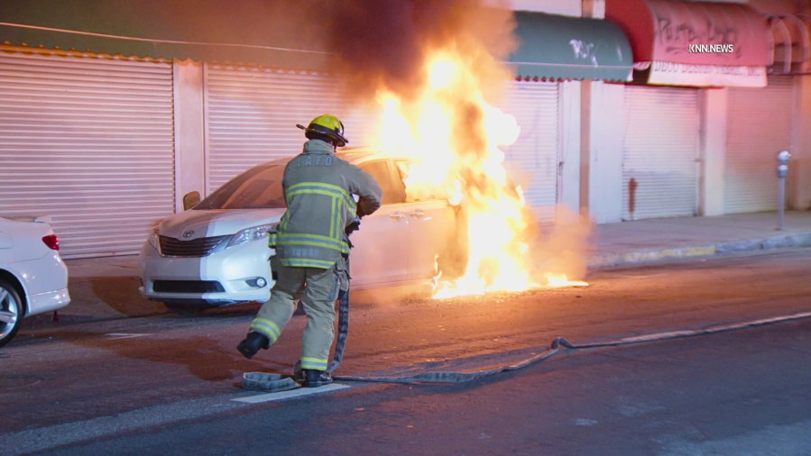 Masked arsonist caught on camera setting fire to minivan outside LA mosque