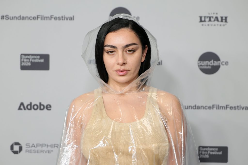 Charli XCX's transparent poncho elevates nude dress