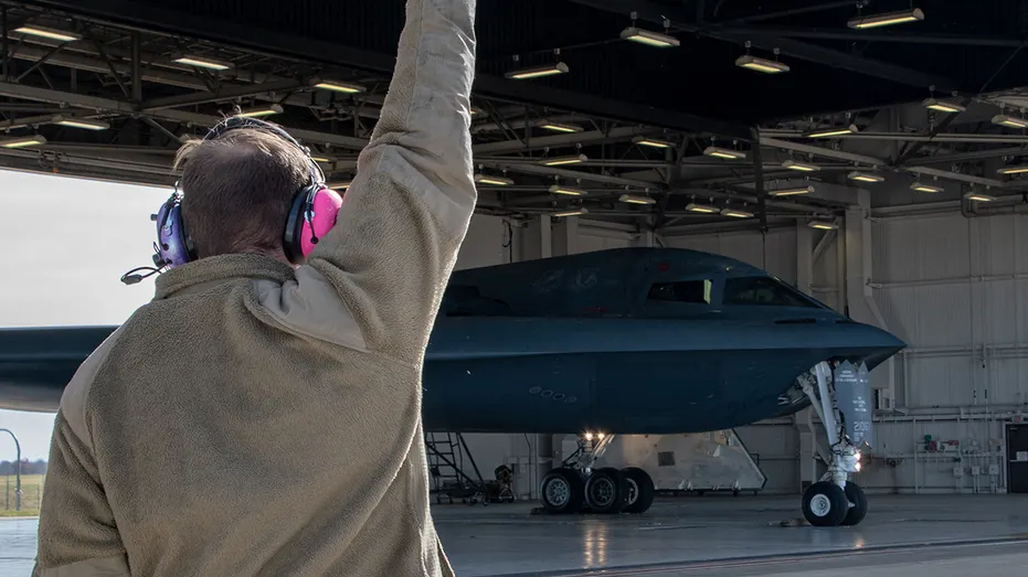Chinese national charged with photographing US stealth bomber base after illegal entry