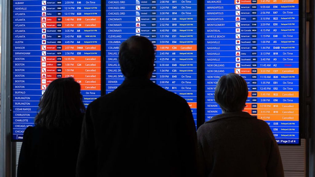 Stock markets react as winter storm prompts airlines to waive change fees