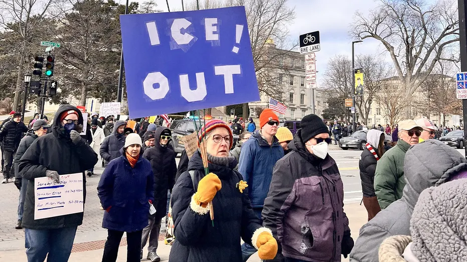 Ohio school counselor's controversial ‘You can't love God and ICE’ sign