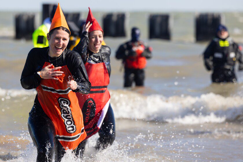 Chicagoans take the plunge in frigid Lake Michigan for charity