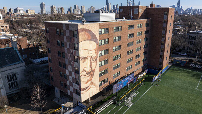 St. Vincent DePaul's murals: university and Red Line loom with his disapproval