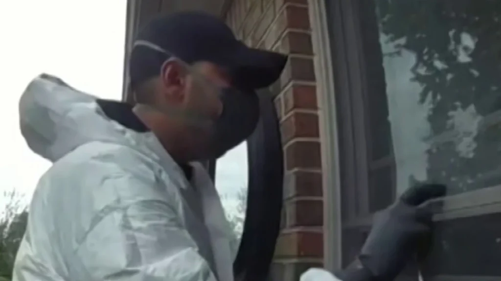 Masked man in hazmat suit attempts break-in