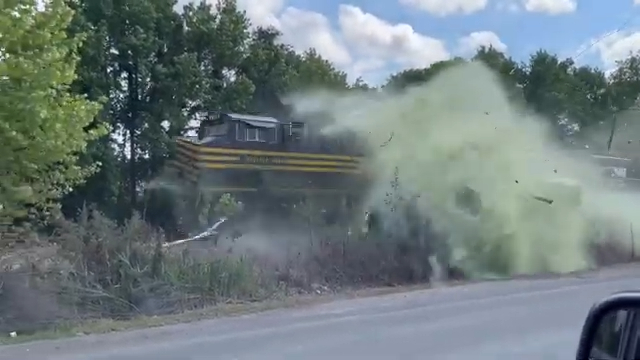 Train smashes into truck with septic tank: video