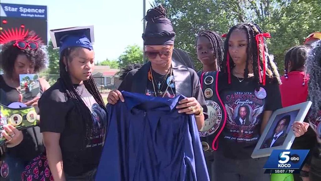Mother walks in slain son's place at graduation