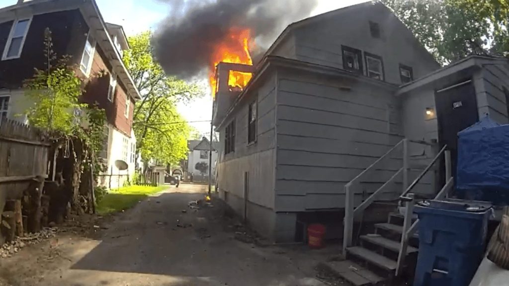 Officer Arnett's Heroic Catch Saves Baby from Kalamazoo Fire