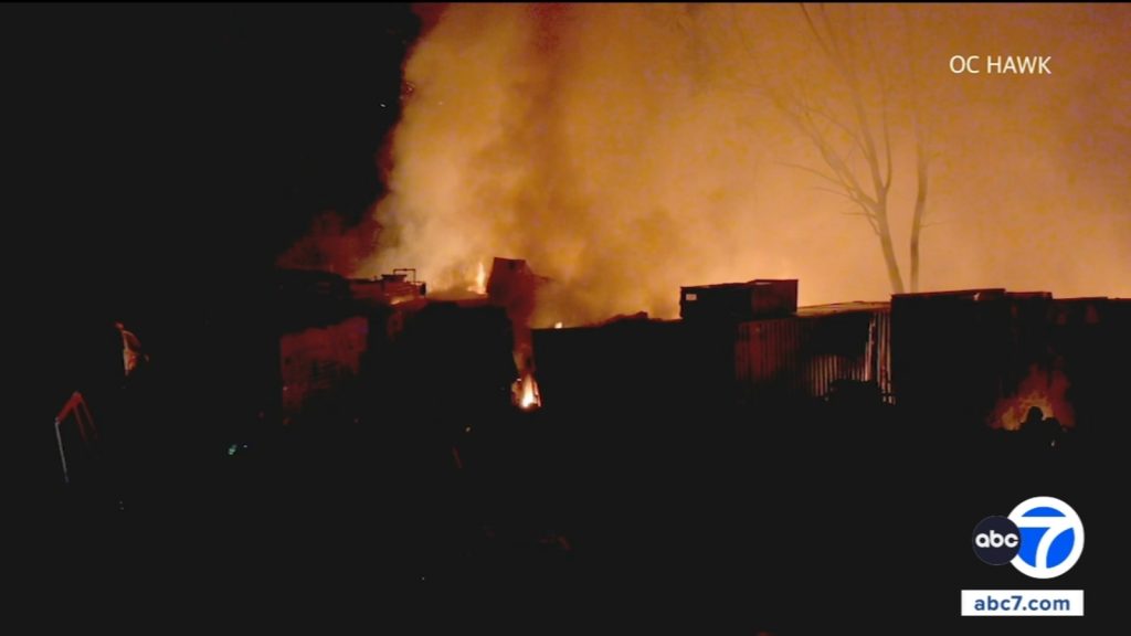 Massive container fire engulfs vehicles, shuts down Highway 74