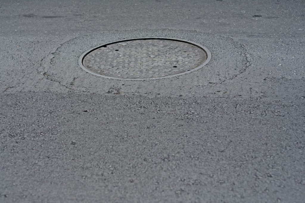 56-year-old woman dies falling into open manhole