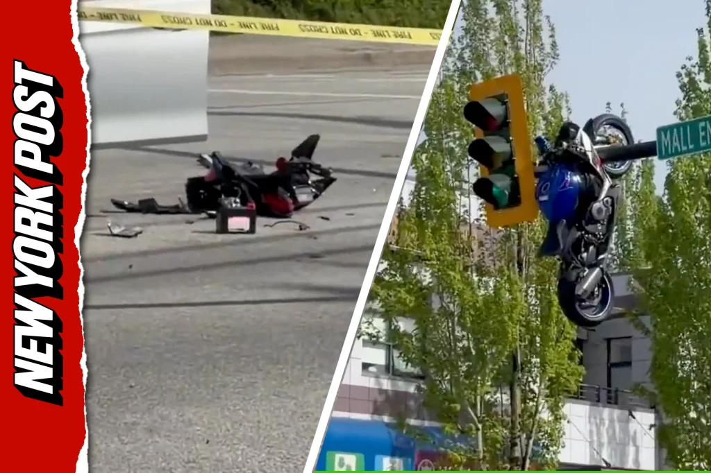 Motorbike dangles from traffic lights after bizarre crash