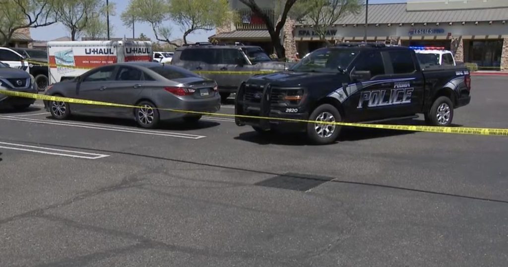 Woman sought after man shot in Peoria parking lot